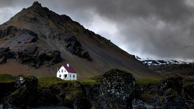 Isolated white house near mountain