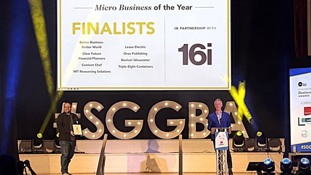 two men on stage with Finalists sign in the background